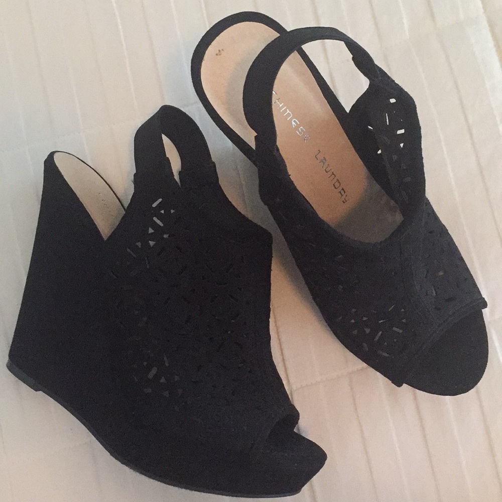 Black wedges, never worn.